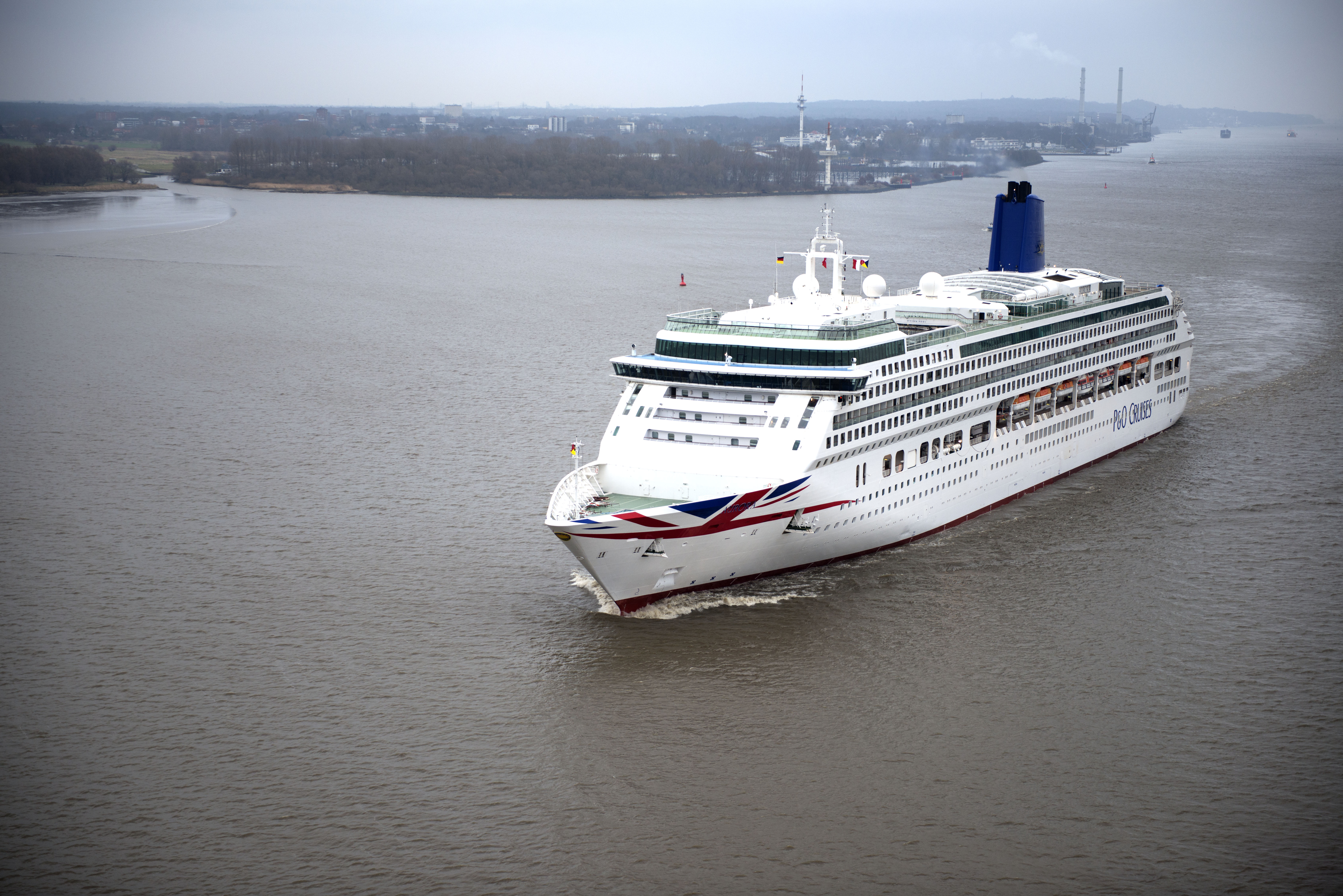 Flying the flag: Aurora leaving Hamburg in its new Union Flag livery (Picture: P&O Cruises)