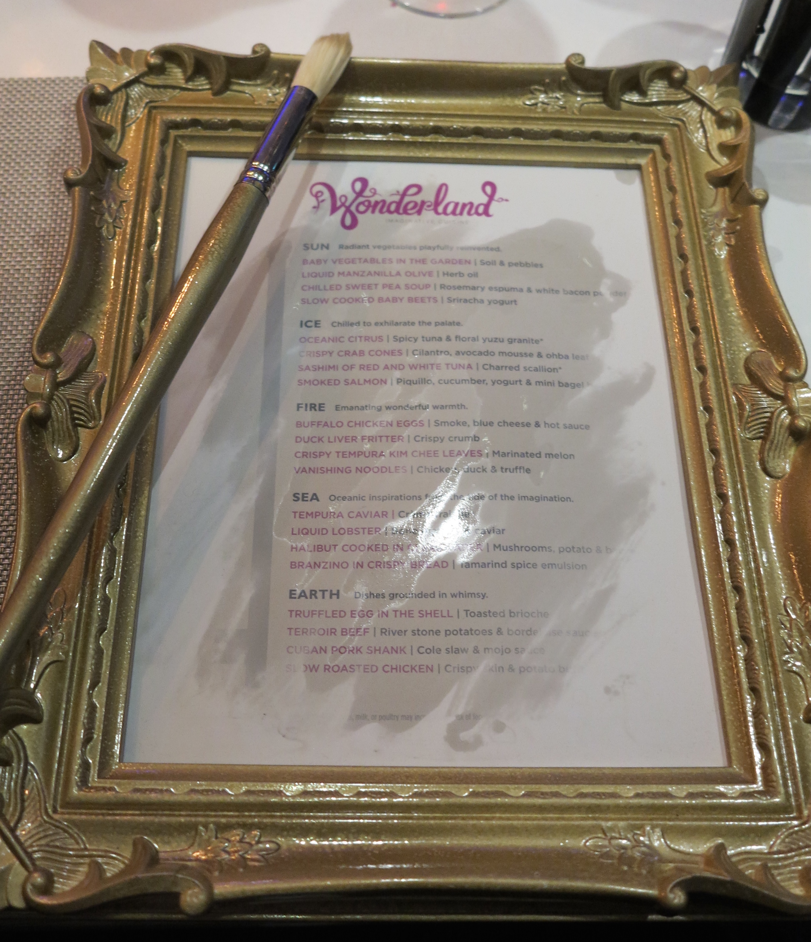 Taste of what's to come: It takes a bit of magic (well, a paint brush and water) to make the Wonderland menu appear